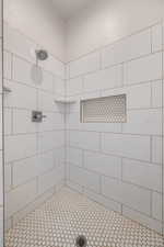 Bathroom with a tile shower