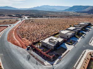 Birds eye view of property with a mountain view