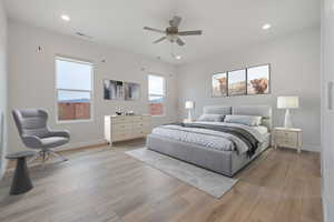 Bedroom with ceiling fan and light hardwood / wood-style floors