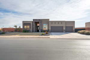 Southwest-style home with a garage