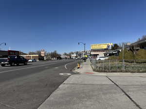 View of road with street lighting and sidewalks