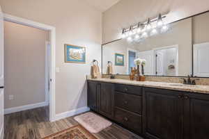 Bathroom featuring hardwood / wood-style floors and vanity