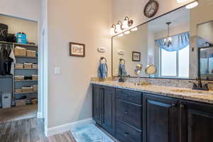 Bathroom with an enclosed shower and vanity