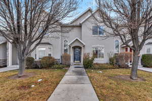 Front facade featuring a front lawn