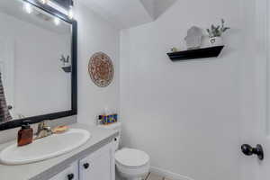 Bathroom featuring toilet and vanity