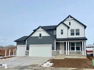 Charming and timeless Craftsman with extended covered porch and 3-car garage.