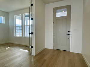 Spacious entry and home office featuring French doors.