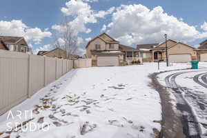 View of yard layered in snow