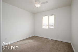 Unfurnished room with carpet flooring and ceiling fan