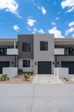 Contemporary house with a garage and central air condition unit