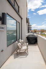 Balcony featuring area for grilling