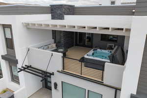 View of patio / terrace with french doors and an outdoor hot tub