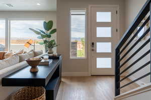 Entryway with light wood-type flooring