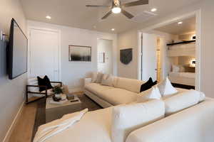 Living room featuring ceiling fan and wood-type flooring