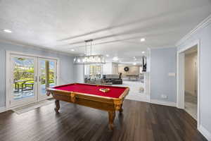 Rec room featuring ornamental molding, french doors, and wood-type flooring