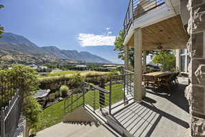 Balcony with ceiling fan and a mountain view