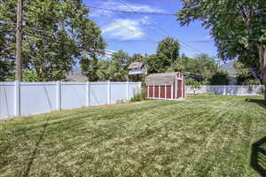 View of yard featuring a storage shed