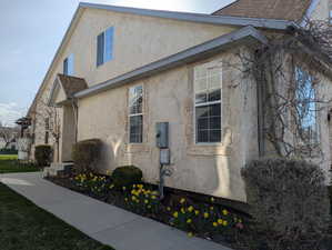 View of property exterior with stucco siding