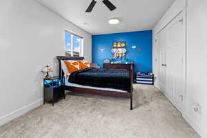 Bedroom with light carpet and ceiling fan