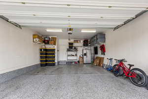 Garage with stainless steel fridge