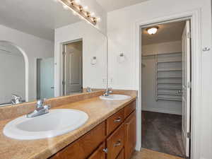 Bathroom with tile patterned floors and vanity