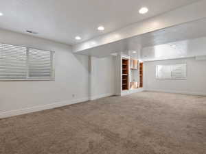 Basement featuring carpet flooring