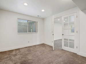 Empty room featuring carpet flooring