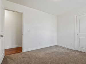 Unfurnished bedroom with carpet