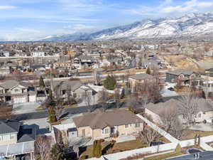 Birds eye view of property featuring a mountain view