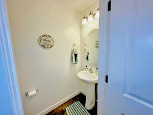 Bathroom with hardwood / wood-style floors