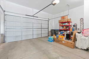 Garage featuring a garage door opener