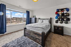 View of carpeted bedroom