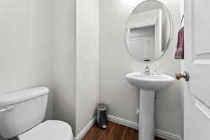 Bathroom with wood-type flooring and toilet