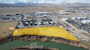 Aerial view featuring a water and mountain view