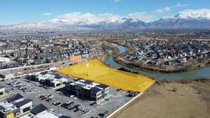 Aerial view featuring a water and mountain view