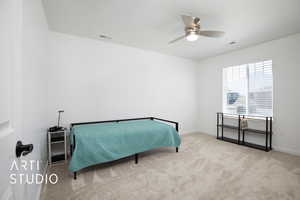 Bedroom featuring light carpet and ceiling fan