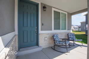 Entrance to property with covered porch