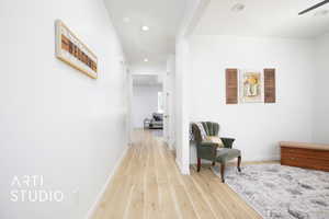 Hall with hardwood / wood-style flooring