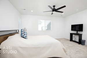 Carpeted bedroom with ceiling fan