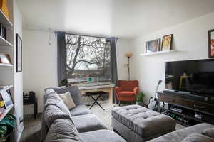 Living room featuring light colored carpet