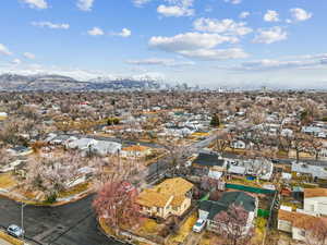 Birds eye view of property with a mountain view