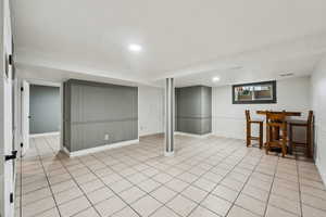 Basement featuring light tile patterned flooring