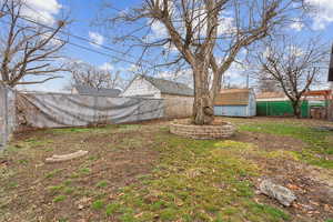 View of yard featuring a storage shed