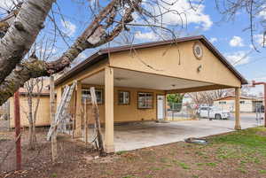 Exterior space featuring a carport