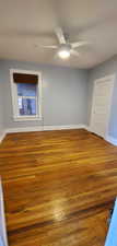 # 9 Master bedroom with light wood-style flooring and ceiling fan