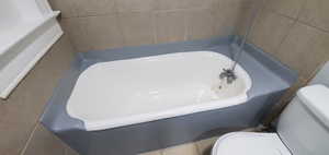 # 9 Bathroom featuring toilet and a tub