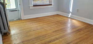 Unit # 4 Detailed view of wood finished floors and radiator