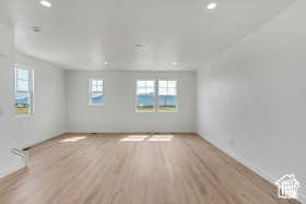 Spare room featuring light hardwood / wood-style floors