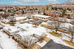 Snowy aerial view featuring a mountain view