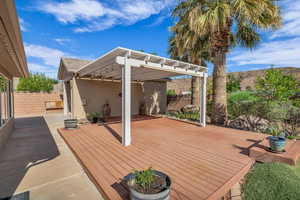 Wooden terrace with fence and a pergola